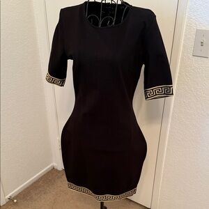 Chic Black Dress with Gold Trim